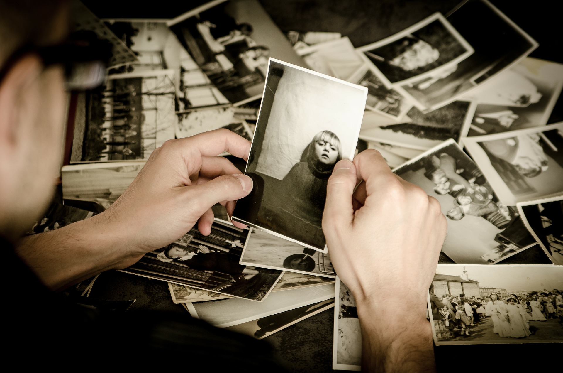 Image of someone looking through old photographs