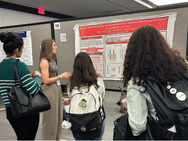 Alisha speaks to a group of conference goers at CNS in Boston.